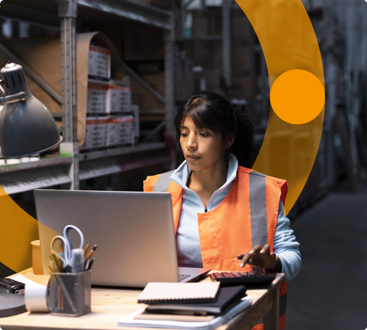 A supply chain manager checking records
          on computer